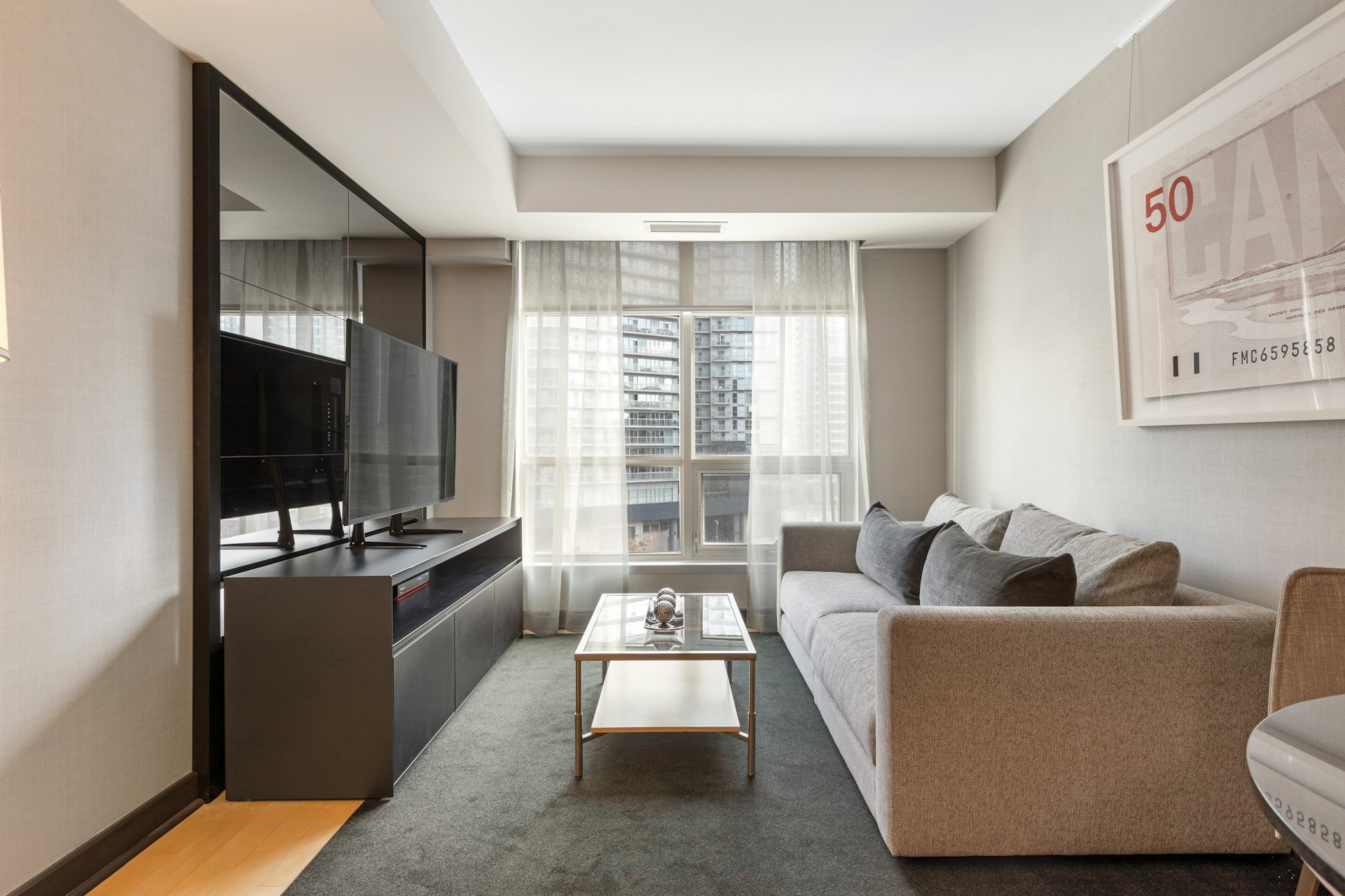 black flat screen tv on black wooden tv rack