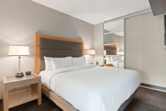 white bed linen on bed