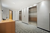 brown wooden cabinet near brown wooden door