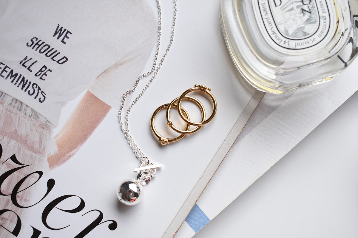 Silver and gold bracelet on white paper demonstrating mixed metal jewelry styling and how to wear gold and silver together
