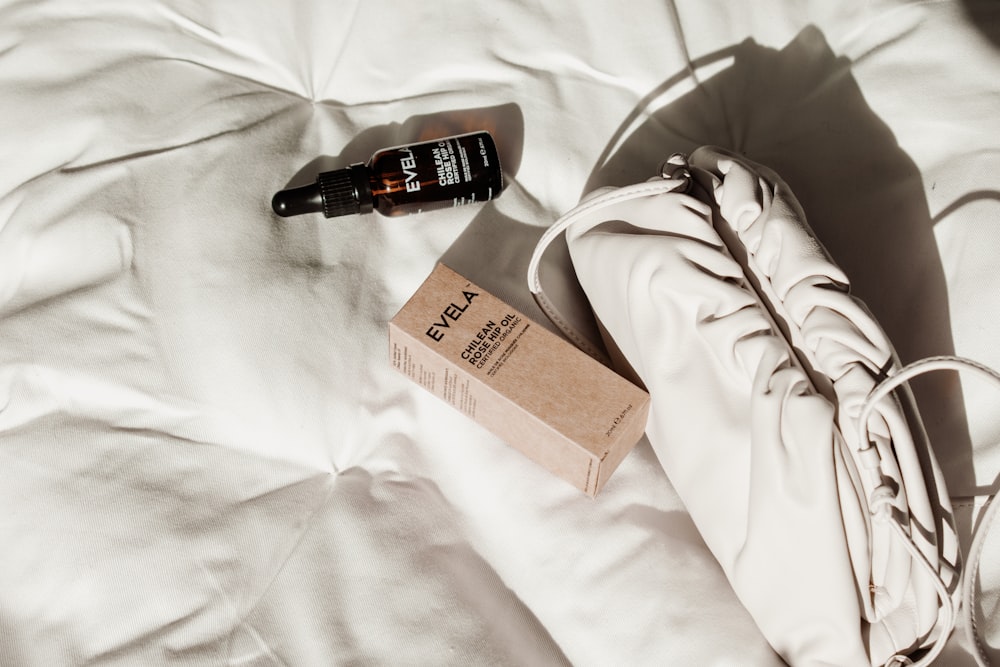 black and white labeled bottle on brown paper bag