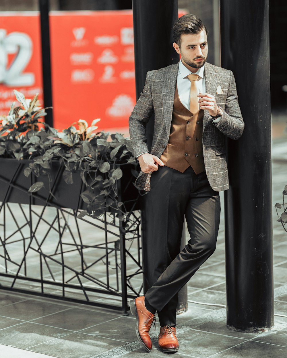 Premium Photo  Fashion young man in black suit and red pants