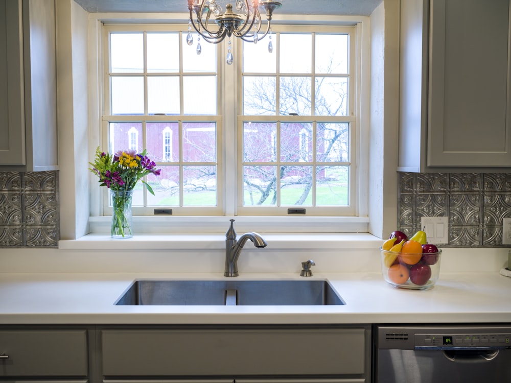 white ceramic sink with stainless steel faucet