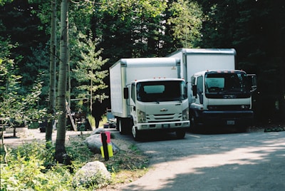 white and black truck on road during daytime