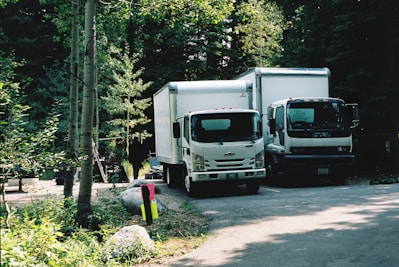 white and black truck on road during daytime