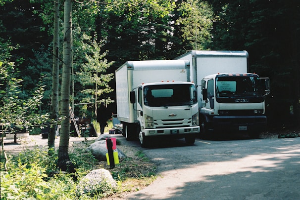 white and black truck on road during daytime
