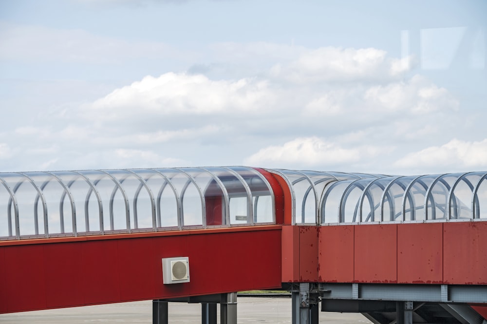 red and white building under white clouds during daytime