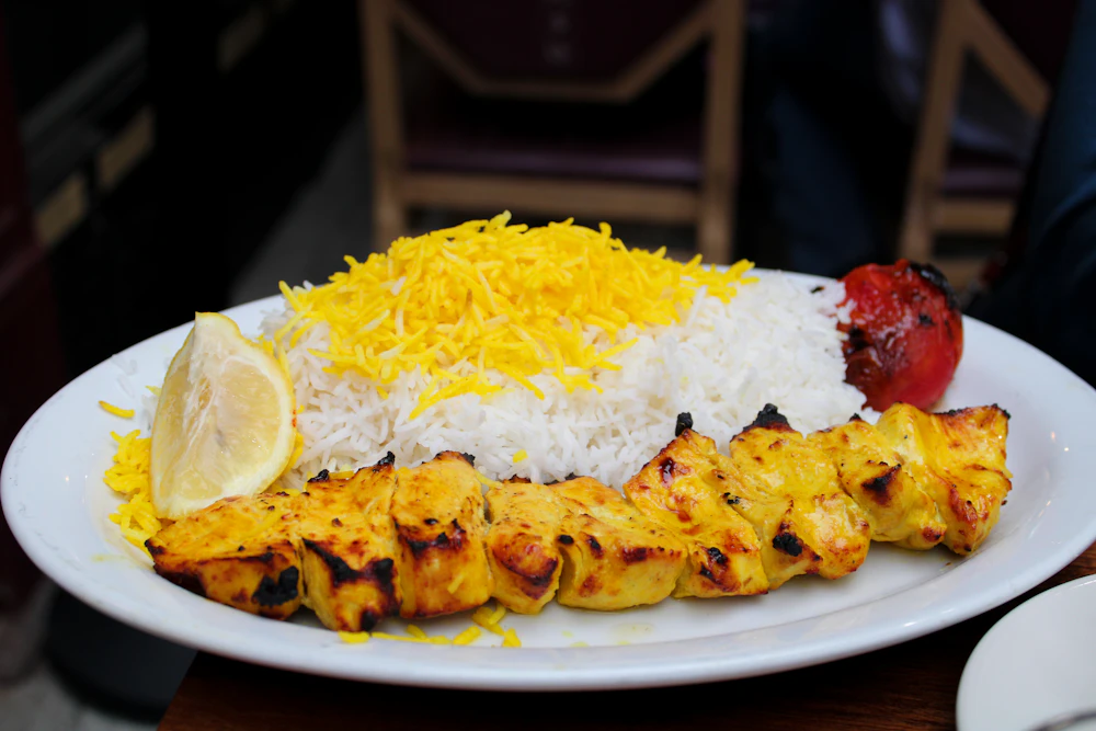 A Persian platter of grilled kabob served over saffron rice
