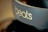 A close-up view of a pair of headphones featuring the brand name 'beats' prominently displayed on the side in light-colored text. The background is blurred, highlighting the focus on the branding.