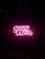 Bright pink neon sign displaying the words 'Good Vibes' against a dark background with a subtle bamboo texture.
