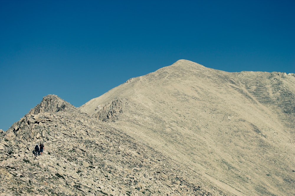 gray rocky mountain under blue sky during daytime