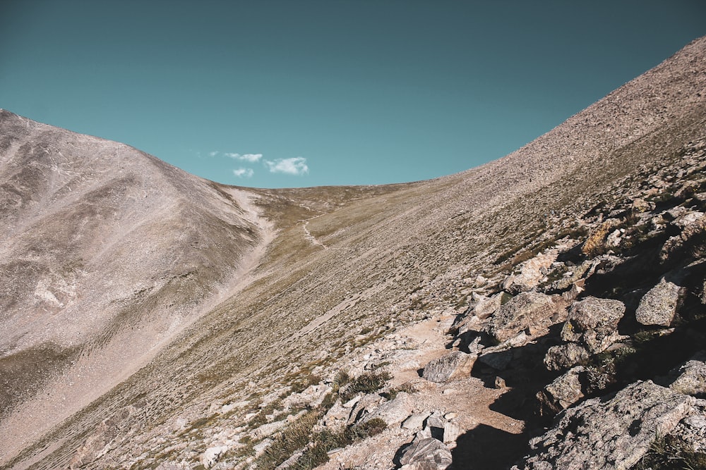 brown mountain under blue sky during daytime