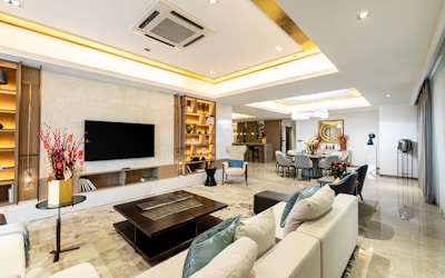 black flat screen tv on white wooden tv rack