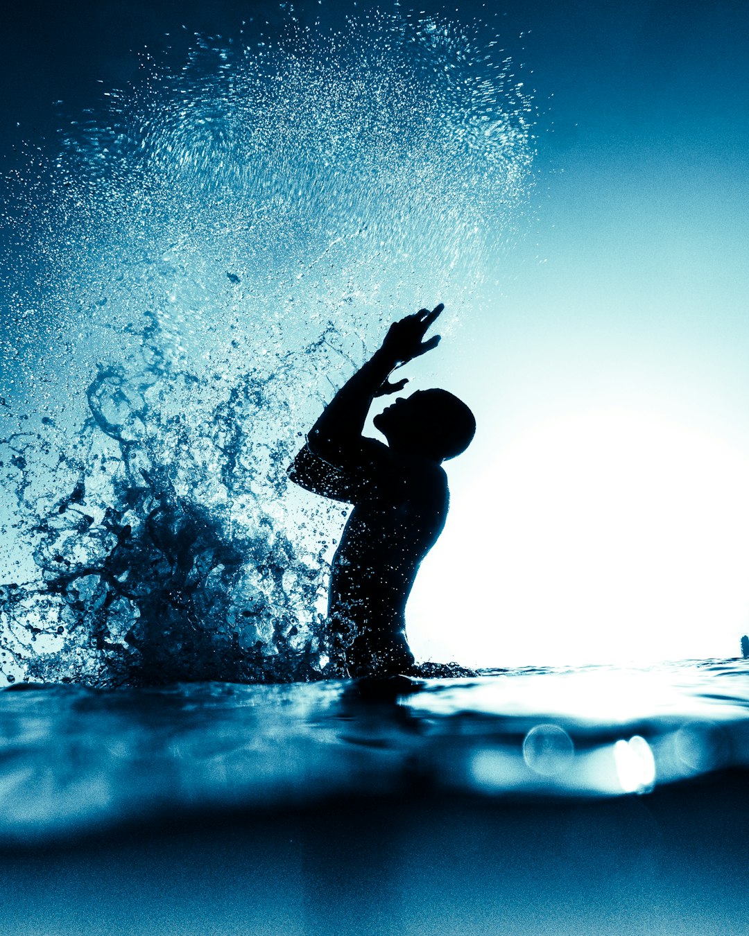 silhouette of person in water