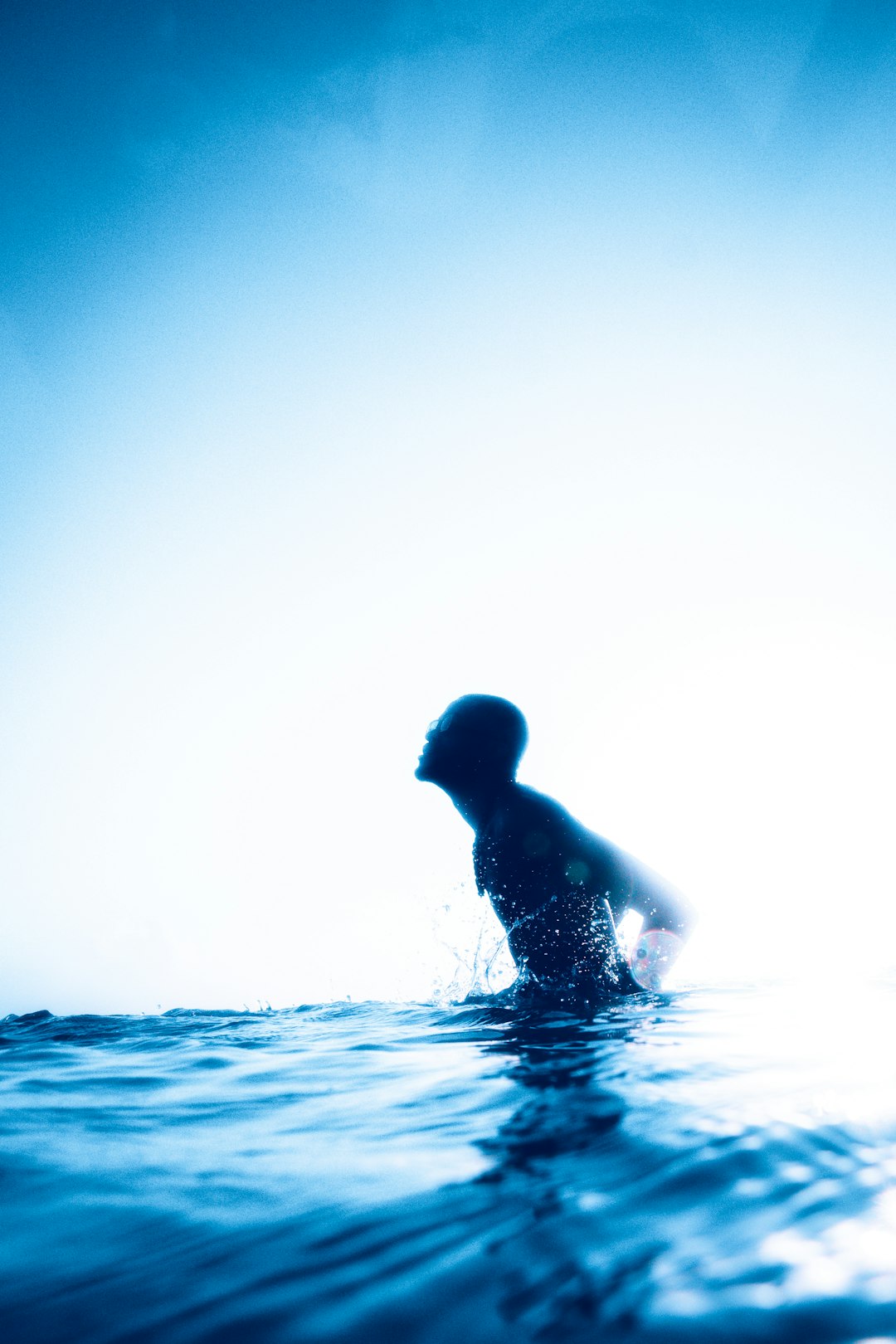 silhouette of woman in water