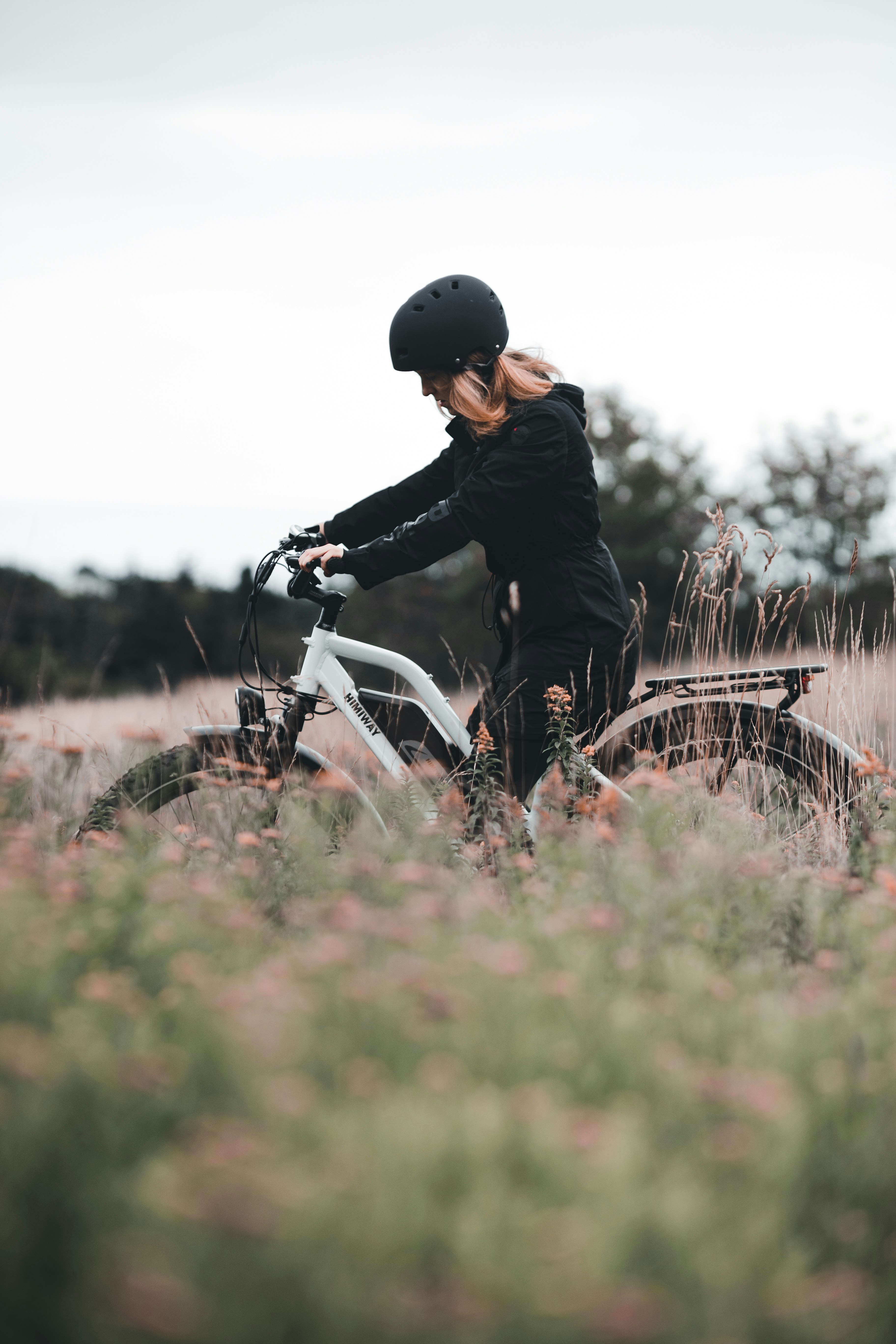 man in black jacket riding white motorcycle during daytime