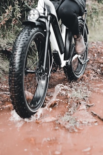 black motorcycle wheel on brown dirt