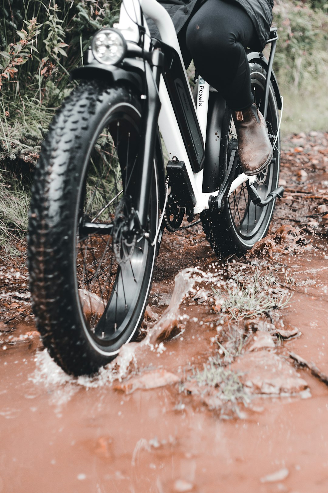 black motorcycle wheel on brown dirt