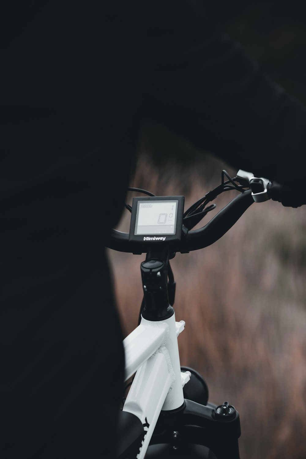 black and white bicycle on brown field during daytime