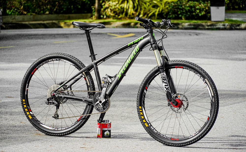 black and red mountain bike on road during daytime