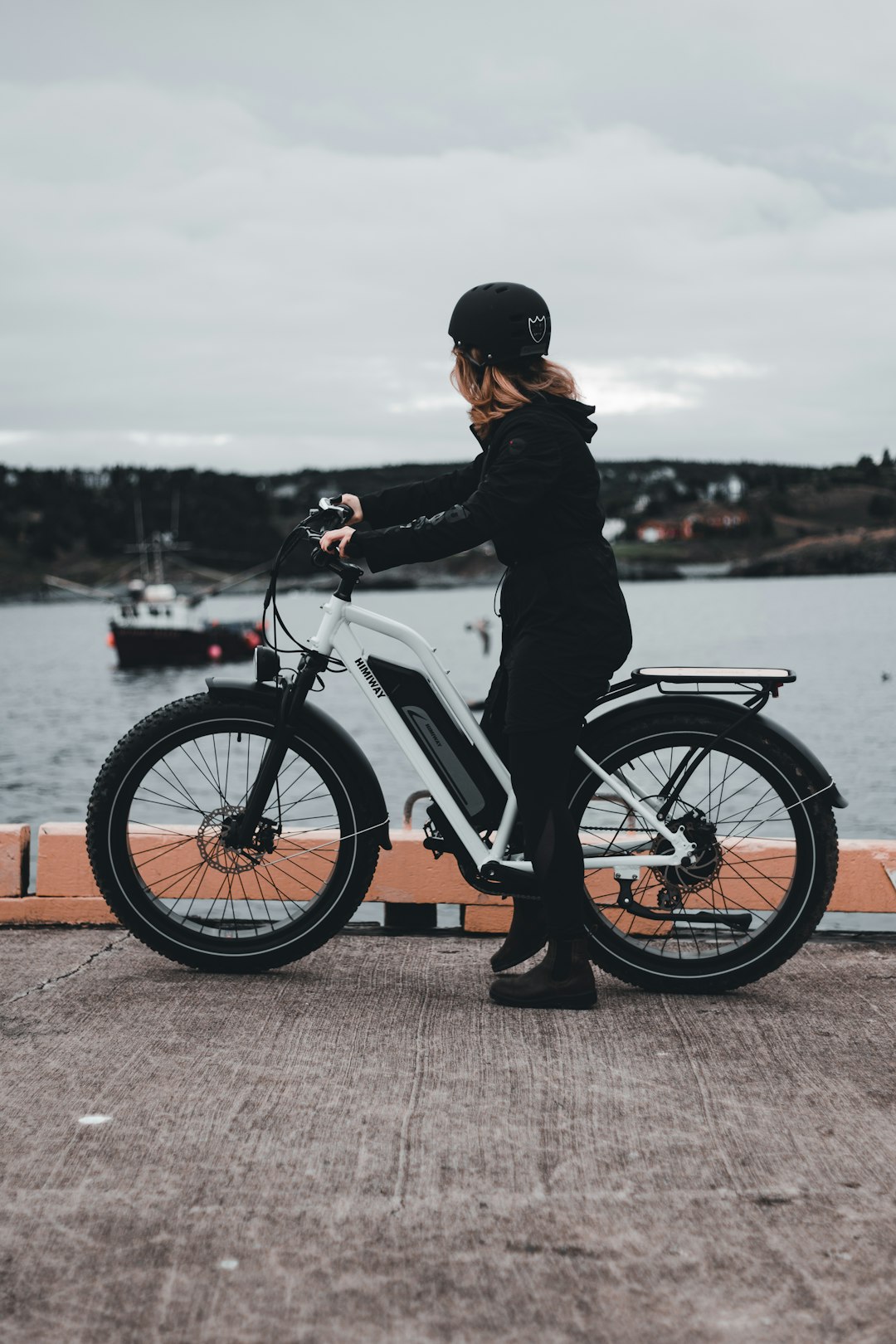 man in black jacket riding white motorcycle during daytime