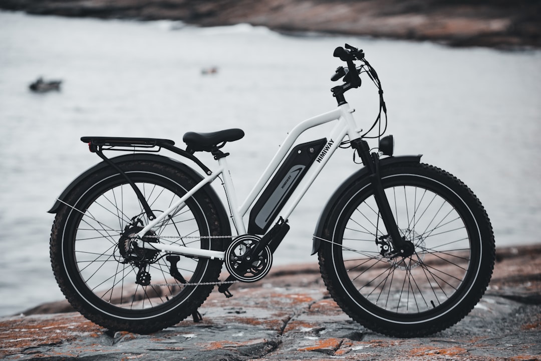 white and black bicycle on brown and gray concrete floor