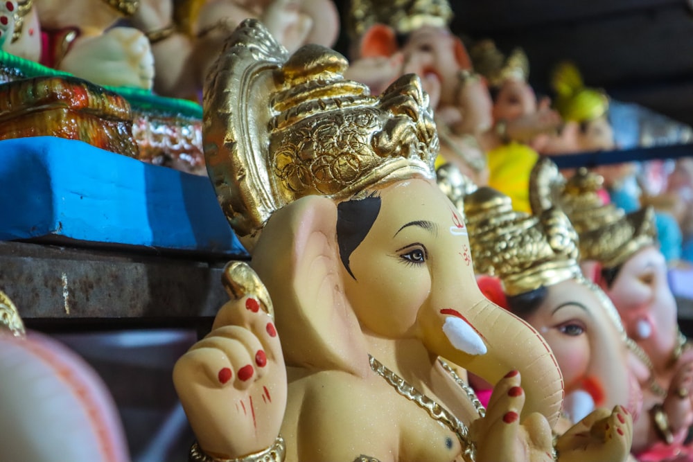 gold and white hindu deity figurine