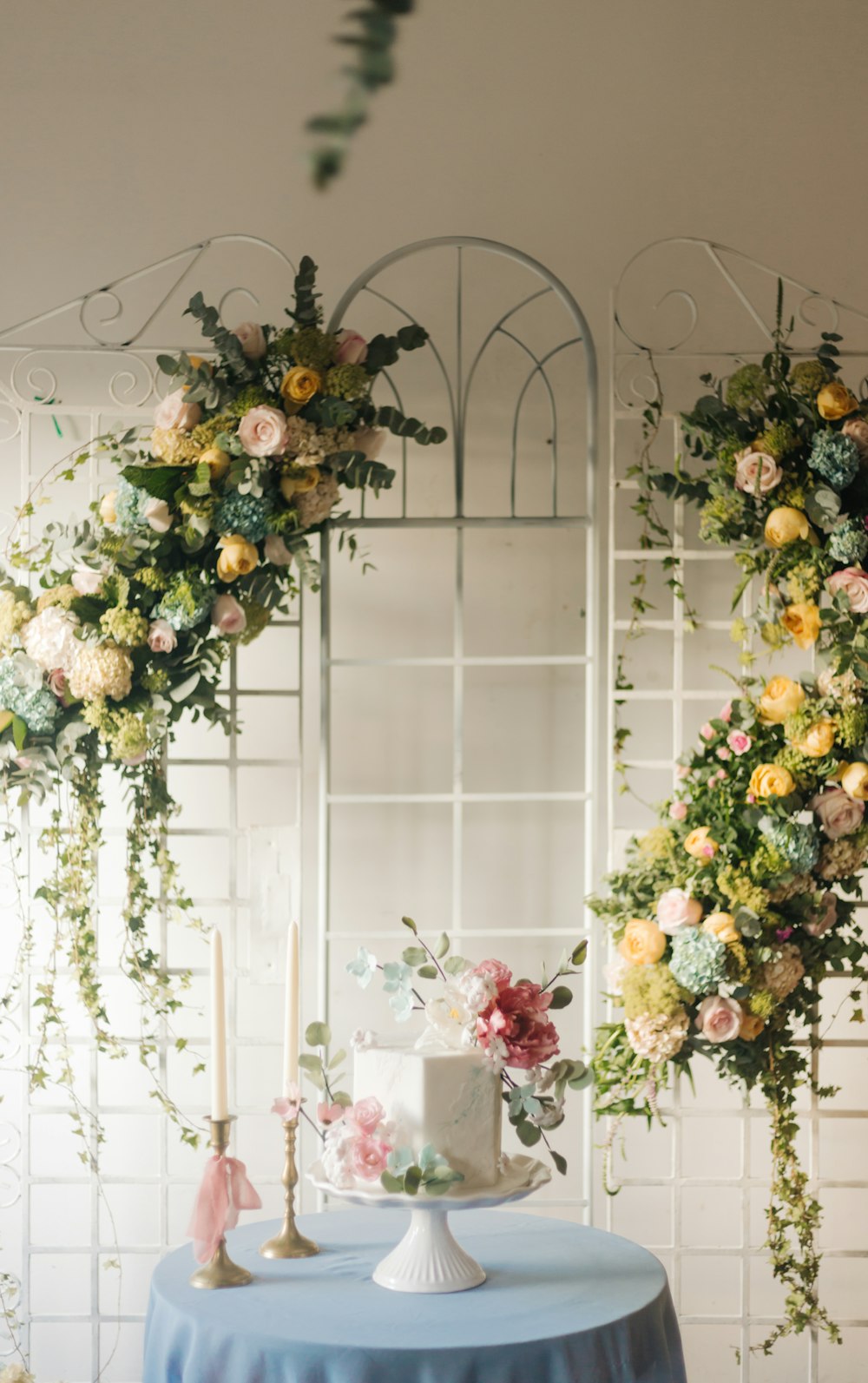 yellow and white flowers on white wooden window