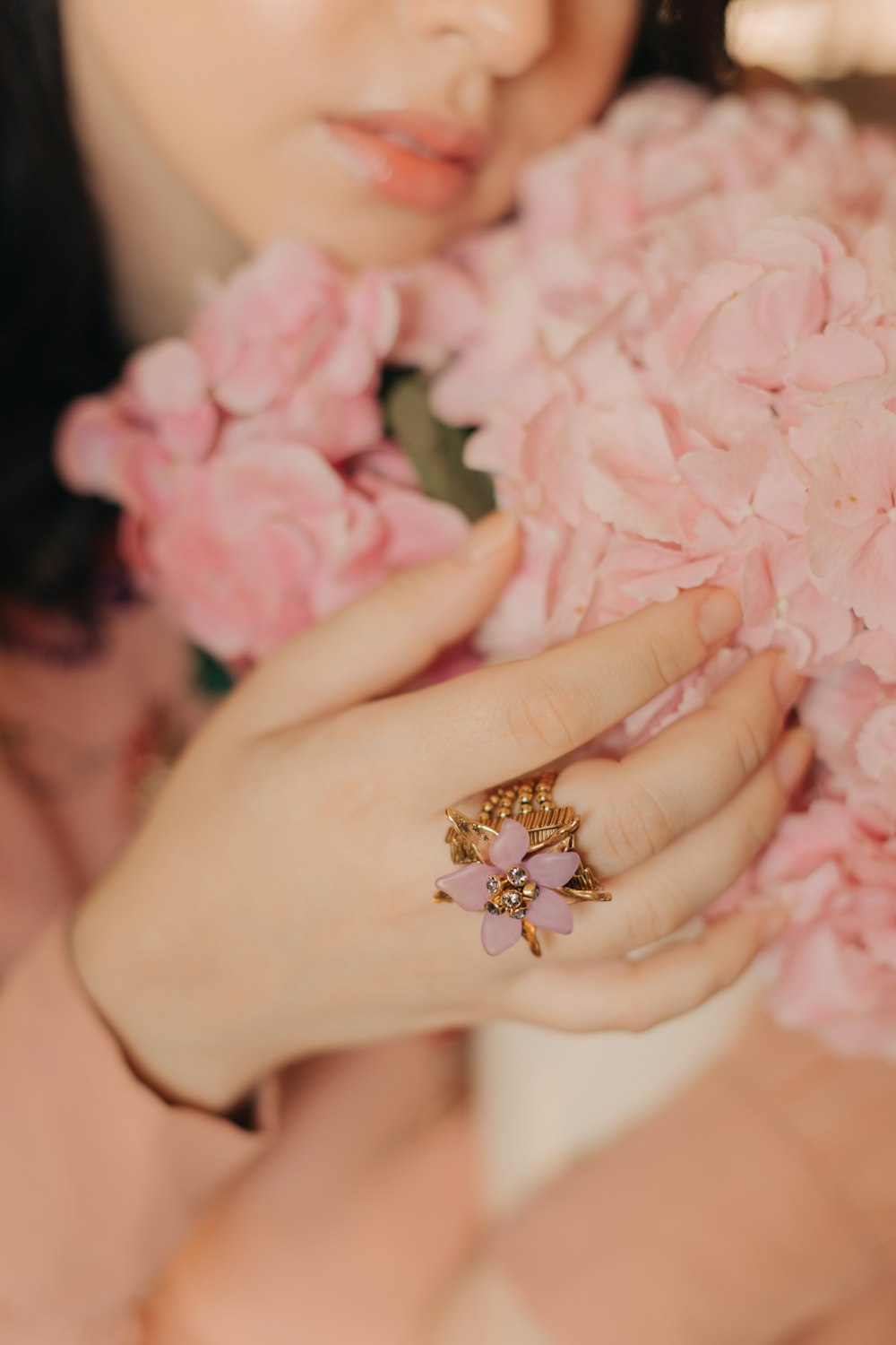 gold diamond ring on persons hand