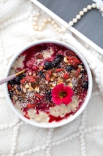 red and black food in white ceramic bowl
