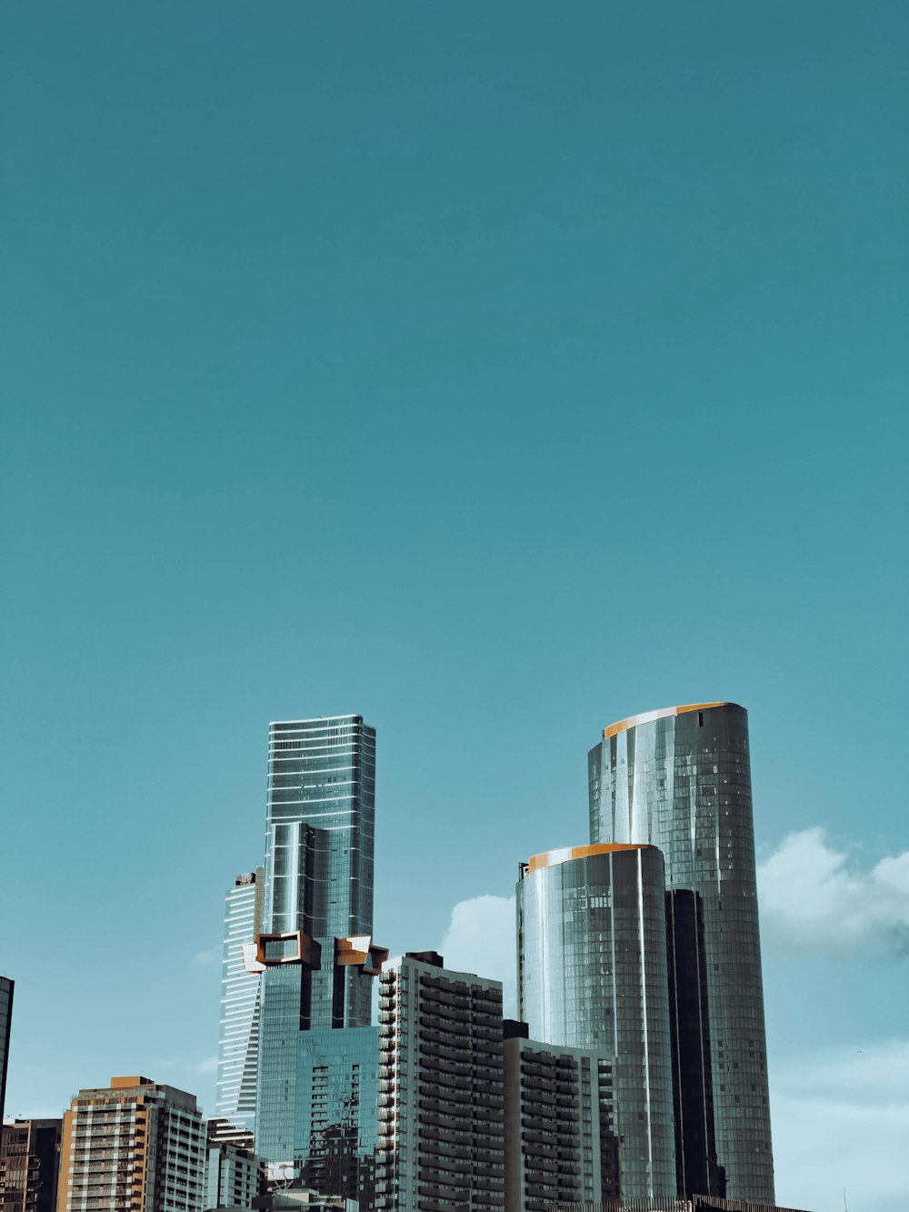 city skyline under blue sky during daytime