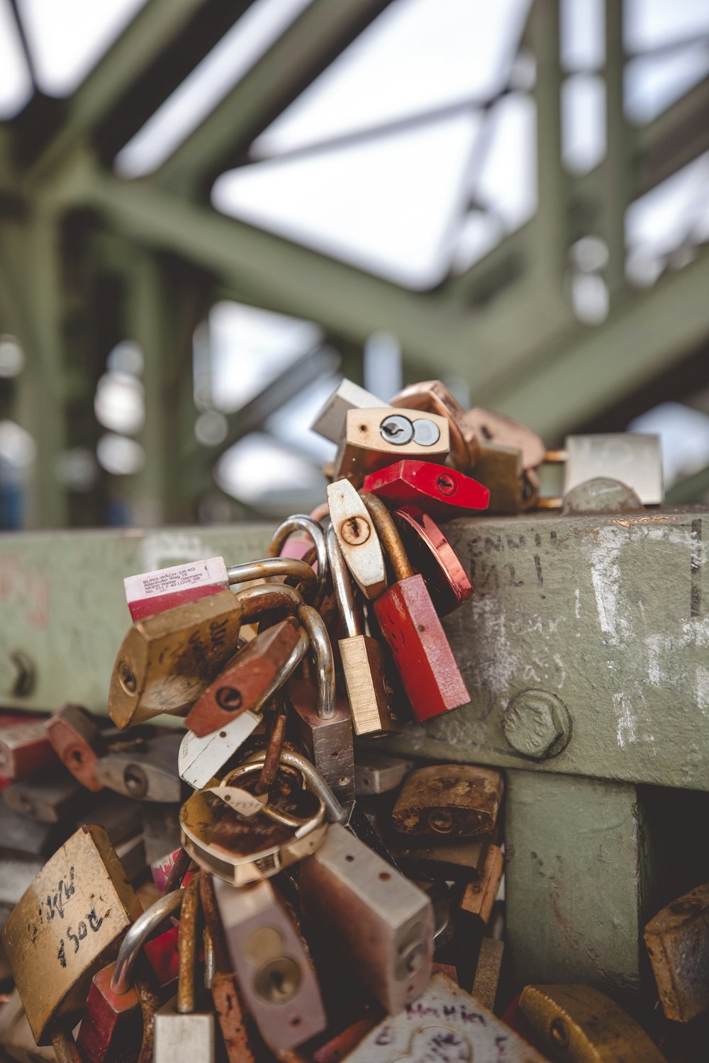 red and gold padlock on grey concrete wall