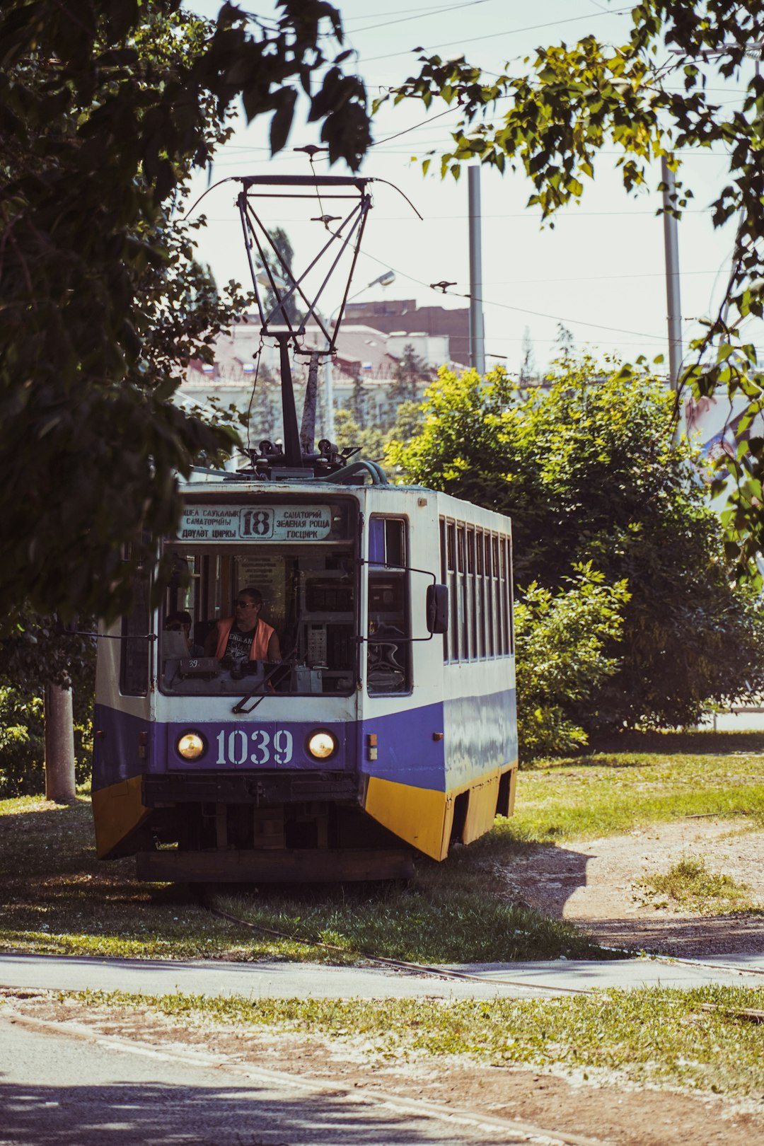 white and yellow train on rail road during daytime