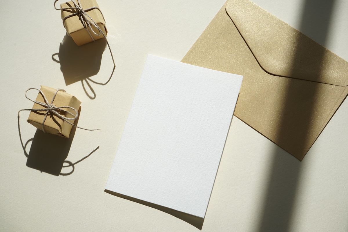 A handwritten thank-you card on a white table, symbolizing volunteer appreciation and recognition.