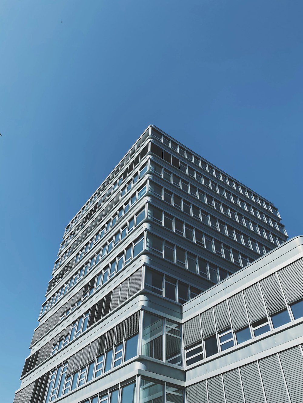 white concrete building under blue sky during daytime