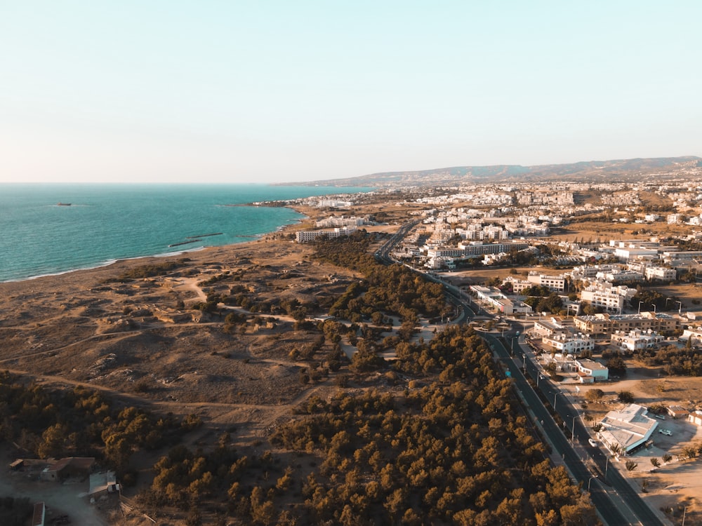 aerial view of city near body of water during daytime