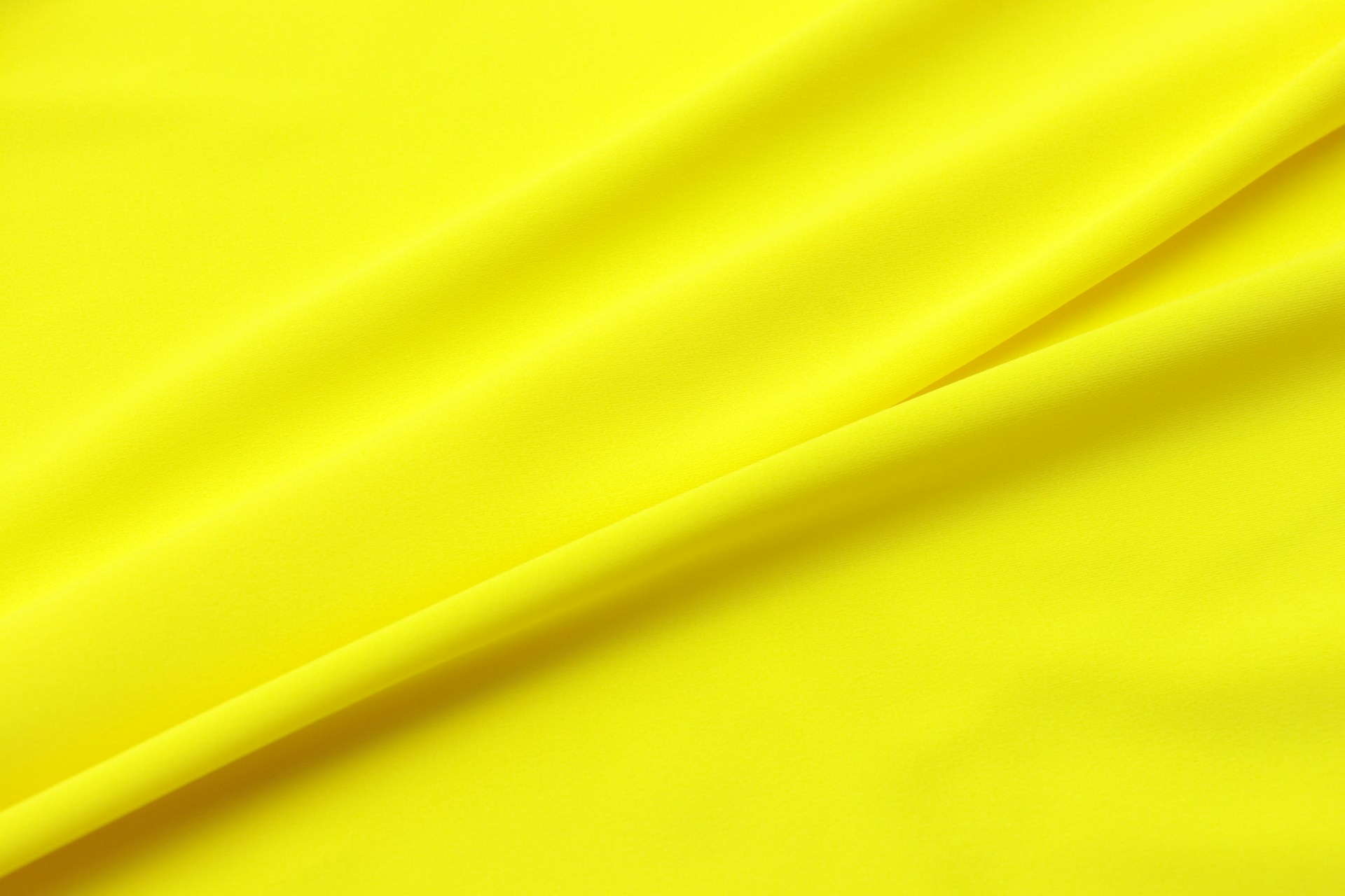 yellow textile in close up photography