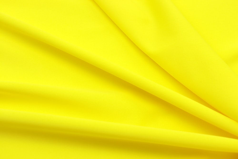 yellow textile in close up photography