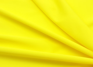 yellow textile in close up photography