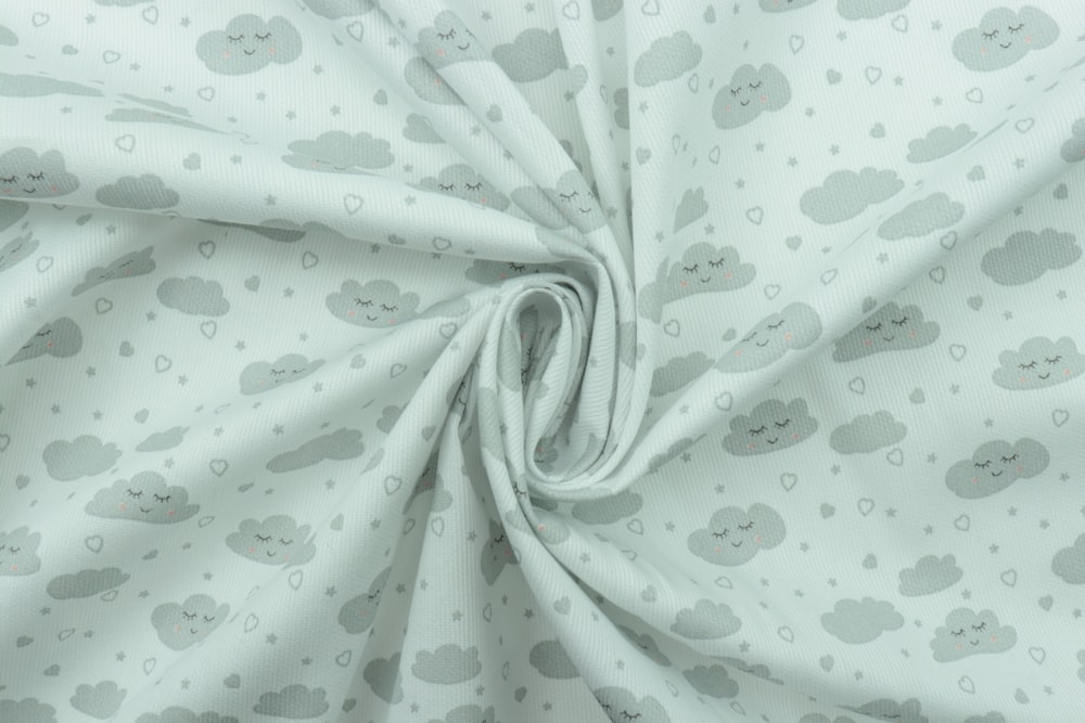 white and green floral textile