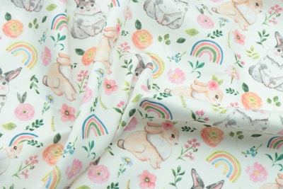 white pink and green floral textile