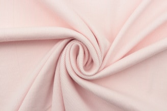 pink textile in close up photography
