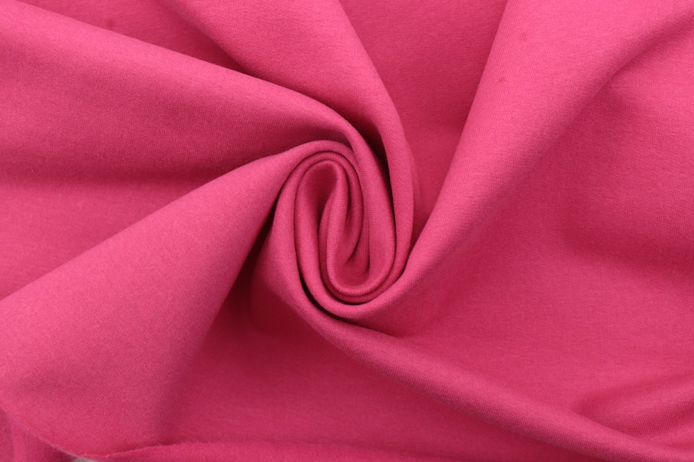 pink textile in close up photography