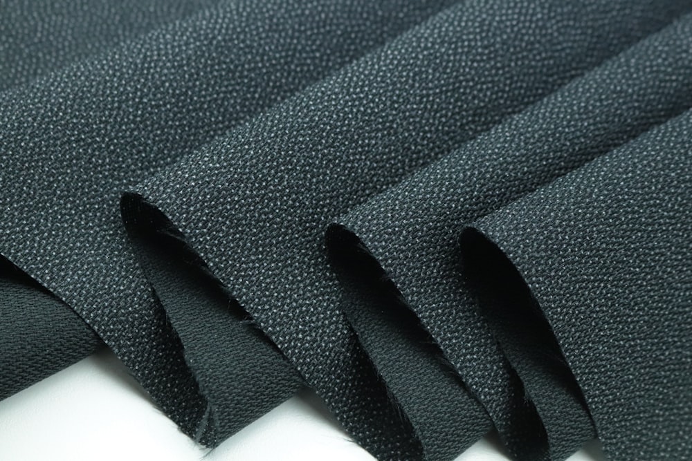 black textile on white surface