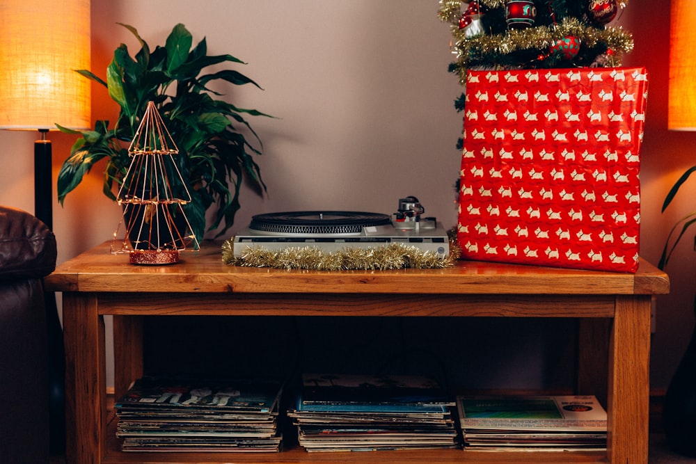 red and white checkered gift box on brown wooden table