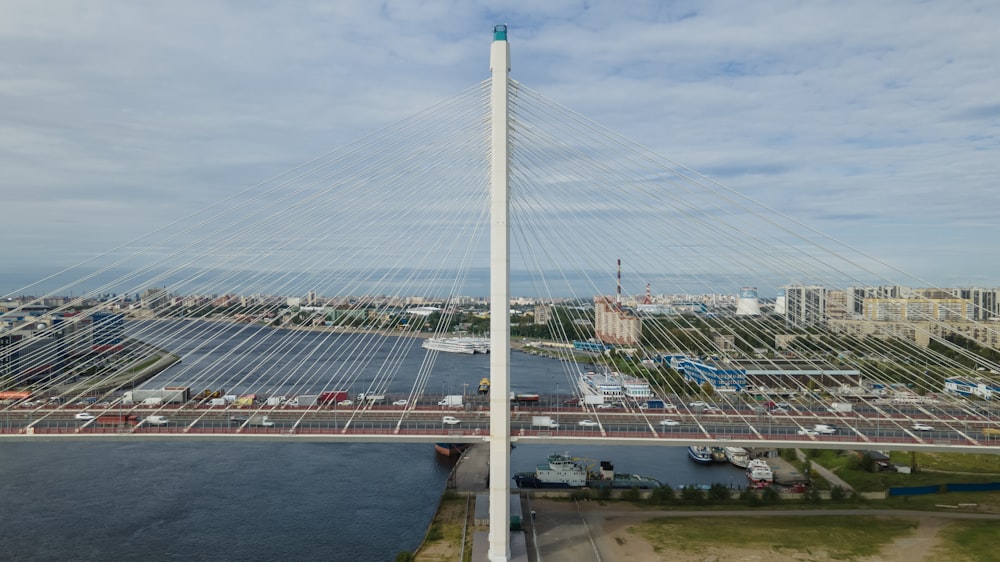 white metal bridge over river during daytime