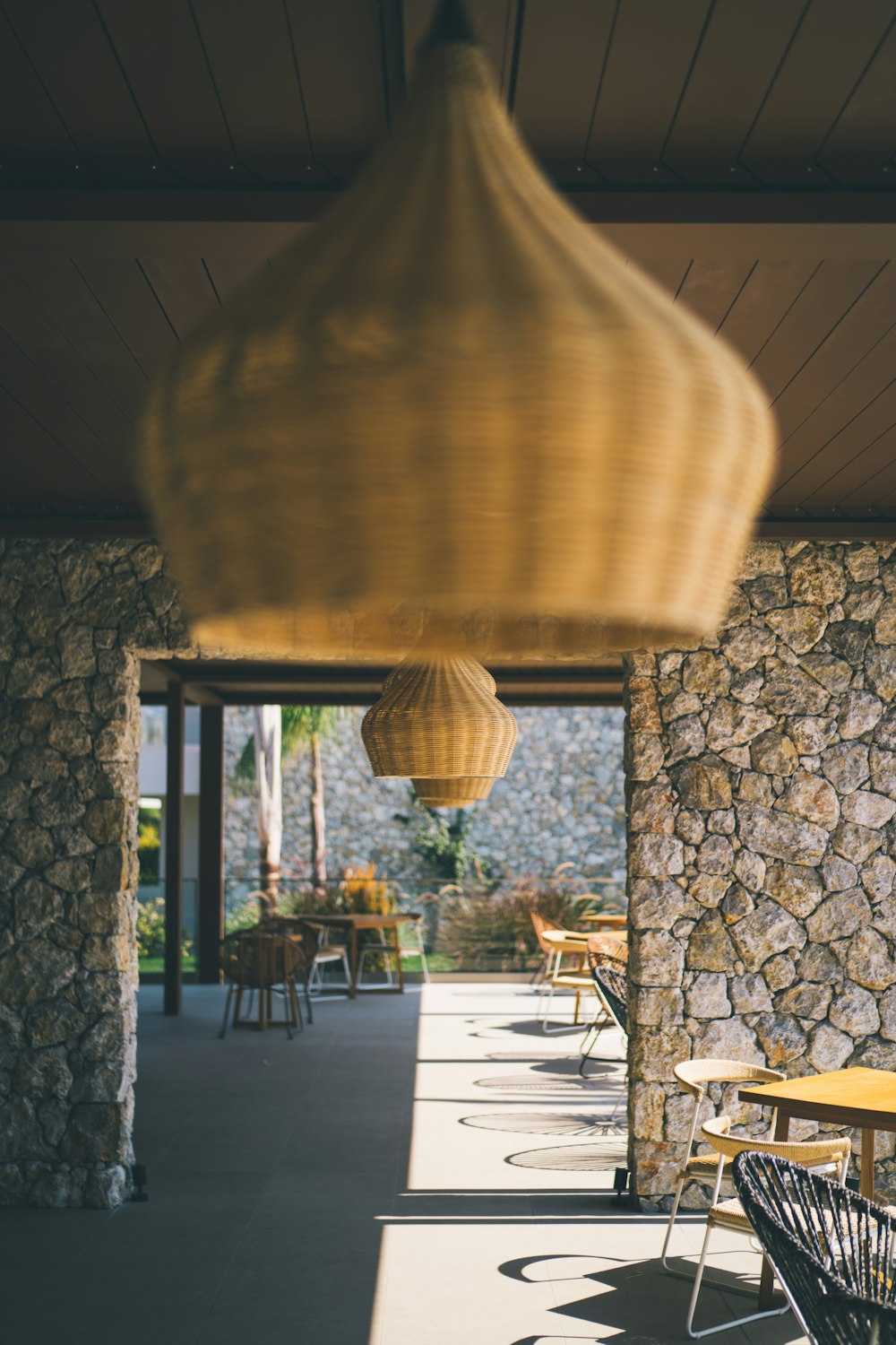 brown pendant lamp turned on during daytime