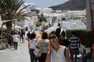 A vibrant coastal town street in Andalusia with locals enjoying a sunny afternoon.