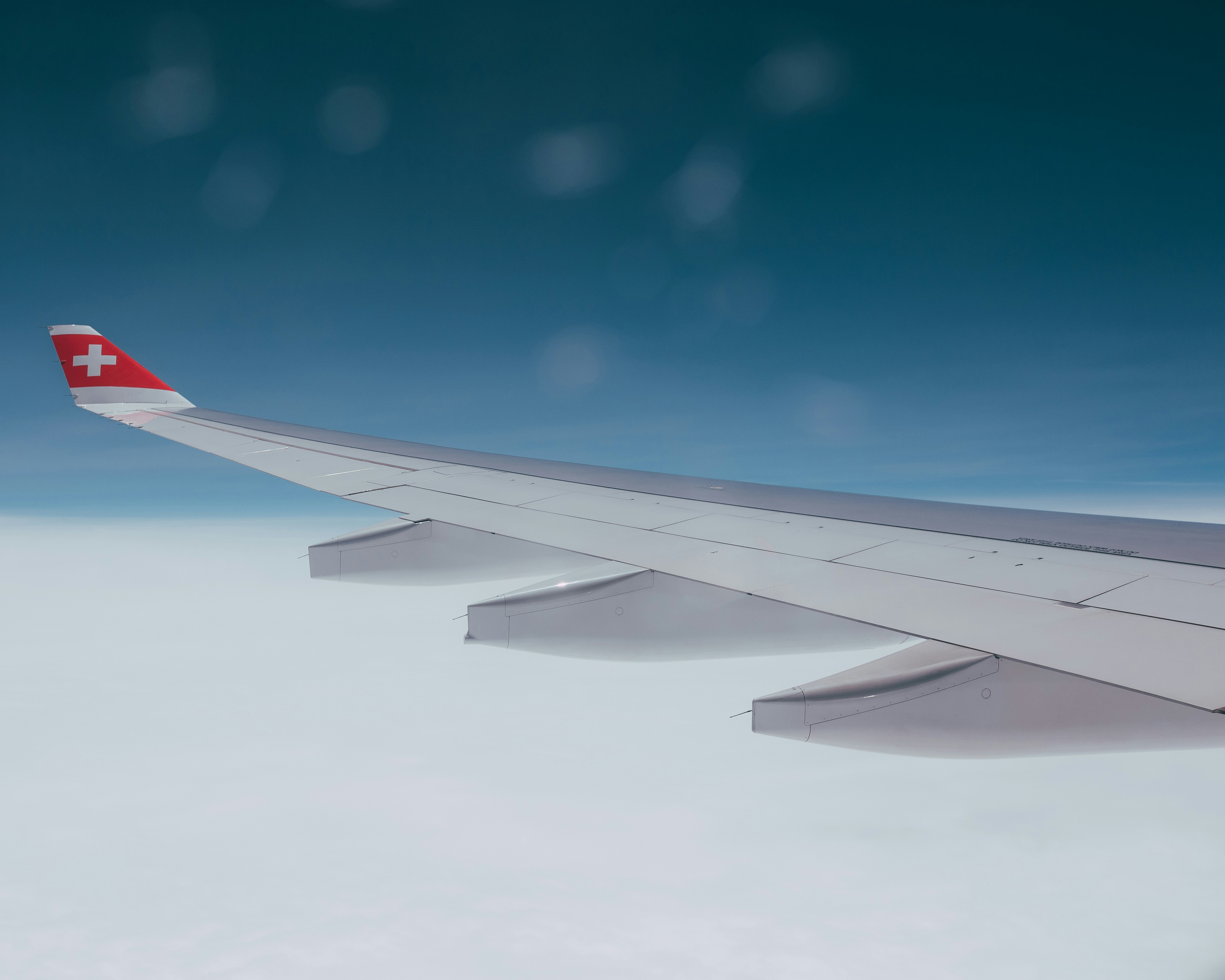 white and red airplane wing during daytime, 