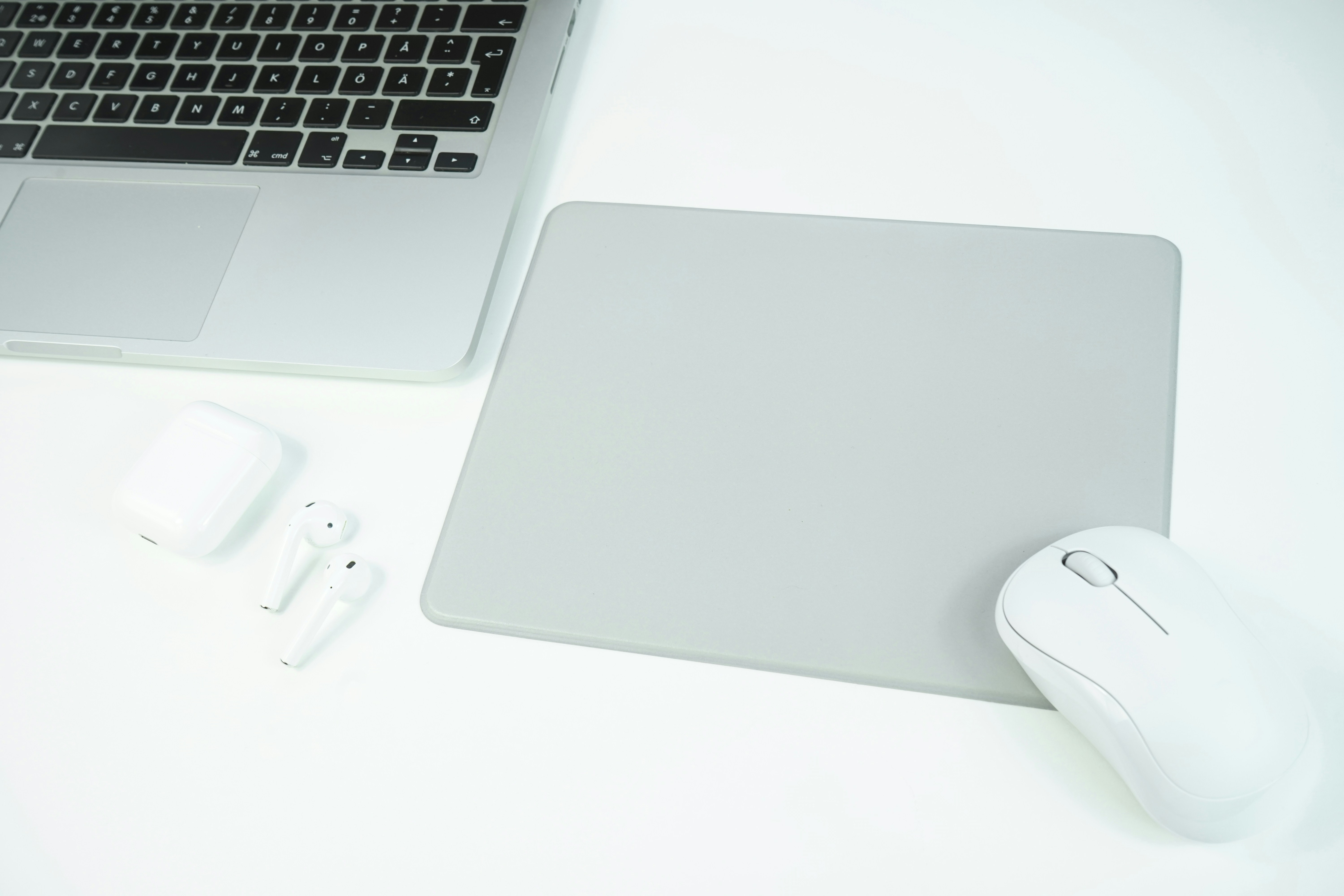 apple magic mouse beside apple magic mouse